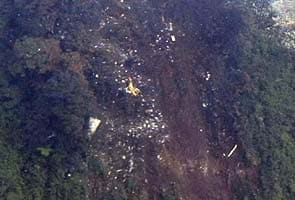 Wreckage of Russian Sukhoi plane strewn on Indonesian mountain, bodies found