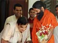 At meeting, BJP President Nitin Gadkari touches Baba Ramdev's feet