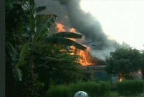 Nine die as Indonesian Air Force plane crashes into housing complex