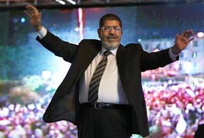 Mohammed Morsi, Egypt's first elected leader says 'national unity is the only way out'