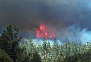 Record-setting New Mexico fire spreading in all directions