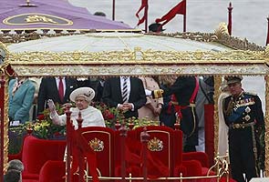 Britain's Queen Elizabeth joins giant jubilee flotilla in London