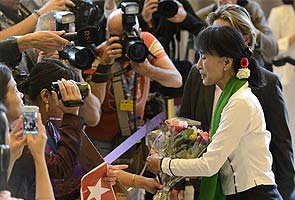 'Exhausted' Suu Kyi to visit Swiss parliament ahead of Oslo 