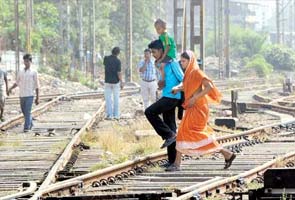 Train runs over mother crossing tracks with child