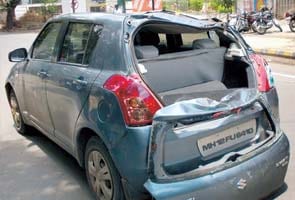 Lucky escape for family as banyan tree crushes car