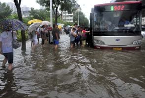 China raises Beijing storm toll to 77 after outcry 