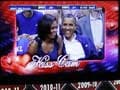 Cheering crowd and arena camera get Obamas to kiss