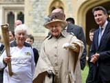 Queen Elizabeth II greets Olympic torch at Windsor Castle