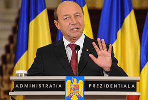 Romania court puts President Basescu back in office