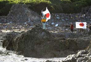 Japan-China island row intensifies after activists raise flag on disputed land