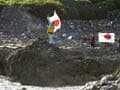 Japan-China island row intensifies after activists raise flag on disputed land
