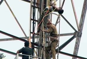Armyman protesting atop tower brought down after 94 hours
