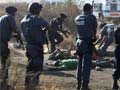 South African police kill more than 30 striking miners