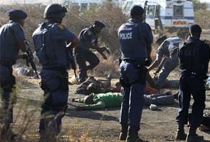 South African police kill more than 30 striking miners