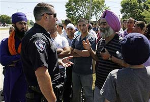 Police search Wisconsin home for motive in Sikh temple shooting