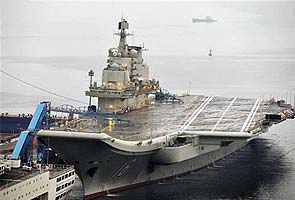 China gets first aircraft carrier amid tensions with Japan