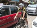 Hong Kong cyclists stuck at government red light