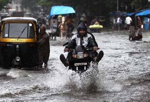 Mumbai rained in: Trains, flights delayed; landslide in Chembur