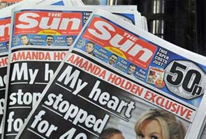 UK phone hacking probe: Sun journalists, police officer arrested for corruption