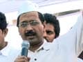Arvind Kejriwal and his supporters protest power tariff hike in Delhi, burn electricity bills