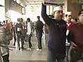 Salman Khurshid returns amid protests at Delhi airport