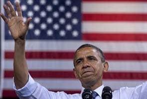 Barack Obama hits campaign trail as storm cleanup gathers pace