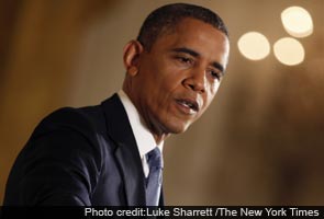 Barack Obama is pressed on Petraeus and holds line on taxes