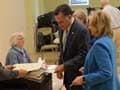 Romney casts ballot, campaigns as people vote