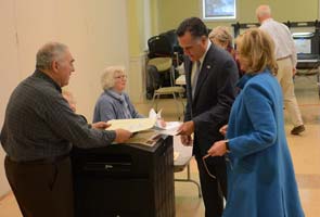 Romney casts ballot, campaigns as people vote