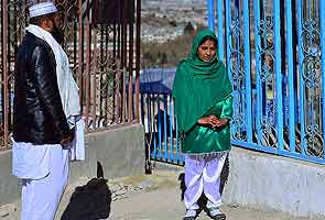 A year on, Afghan 'girl-in-green' revisits Ashura massacre site 