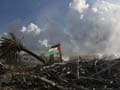 Gaza crowds surge at Israel border fence, one dead