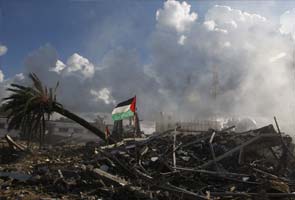 Gaza crowds surge at Israel border fence, one dead