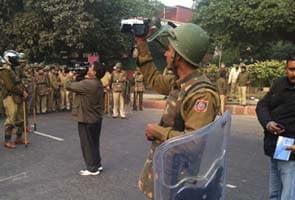 At today's protests in Delhi, cops held video cameras, just in case