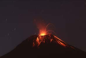 Ecuador volcano spews lava, ash