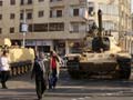 Tanks outside Egypt presidential palace, streets calmer