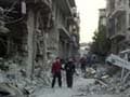 Syrian forces pound Damascus suburbs, flights to resume