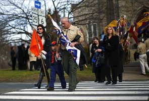 Silence, ringing of bells to honor victims of US school massacre