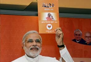 Narendra Modi releases BJP's manifesto for Gujarat Assembly polls