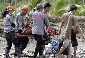 Philippines starts to bury dead as typhoon toll hits 418