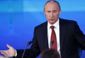 Vladimir Putin vows to sign anti-US adoption bill