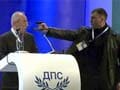 Man holds pistol at Bulgaria politician's head during speech