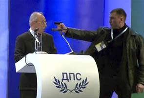 Man holds pistol at Bulgaria politician's head during speech