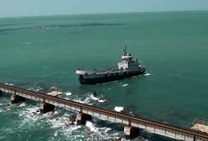 Tug ship stuck dangerously close to 100-year-old rail bridge in Tamil Nadu