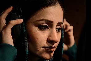 'First' Afghan female rapper seeks reason with rhymes