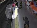 Spain video shows police officer saving woman from tracks