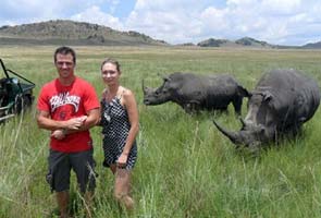 Tourist gored by rhino after wildlife expert asked her to 'stand closer' to the animal for photos