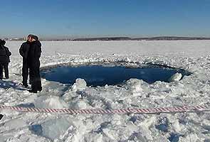 Divers scour Russian lake after meteor strike injures 1,200 Russians
