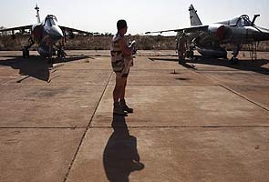 French planes pound Islamist camps in north Mali desert