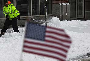 US Northeast digs out from blizzard, storm brewing in plains