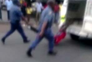 South Africa probes death of man dragged behind police van